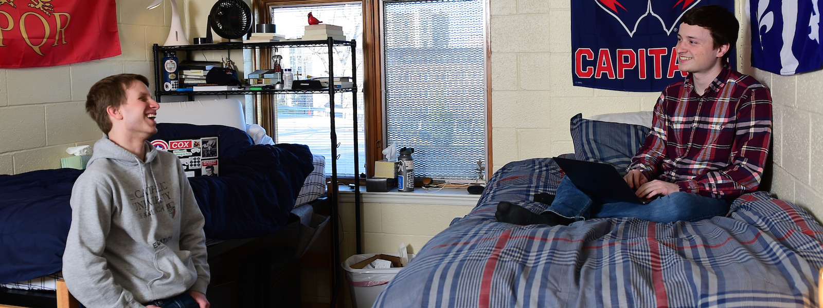 Male students in residence hall room