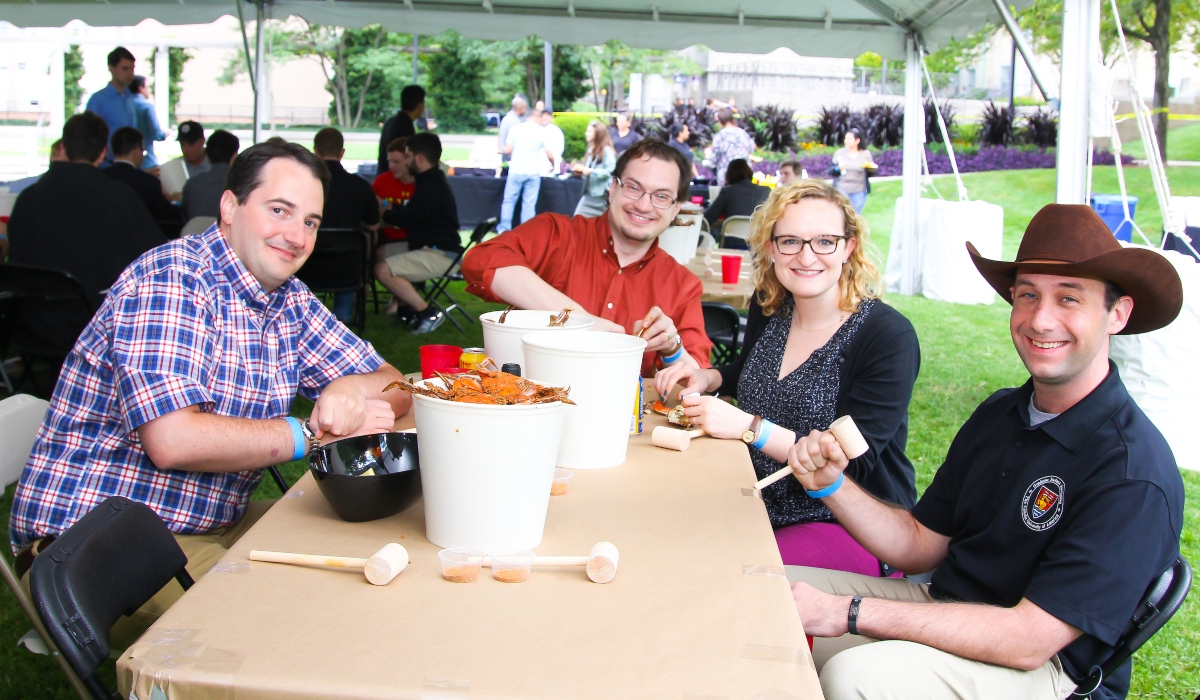 Graduate students at on-campus crab feast