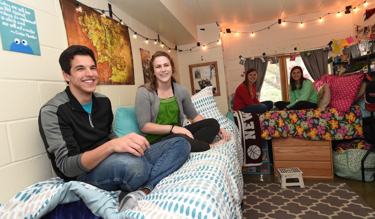 Students hanging out in residence hall room